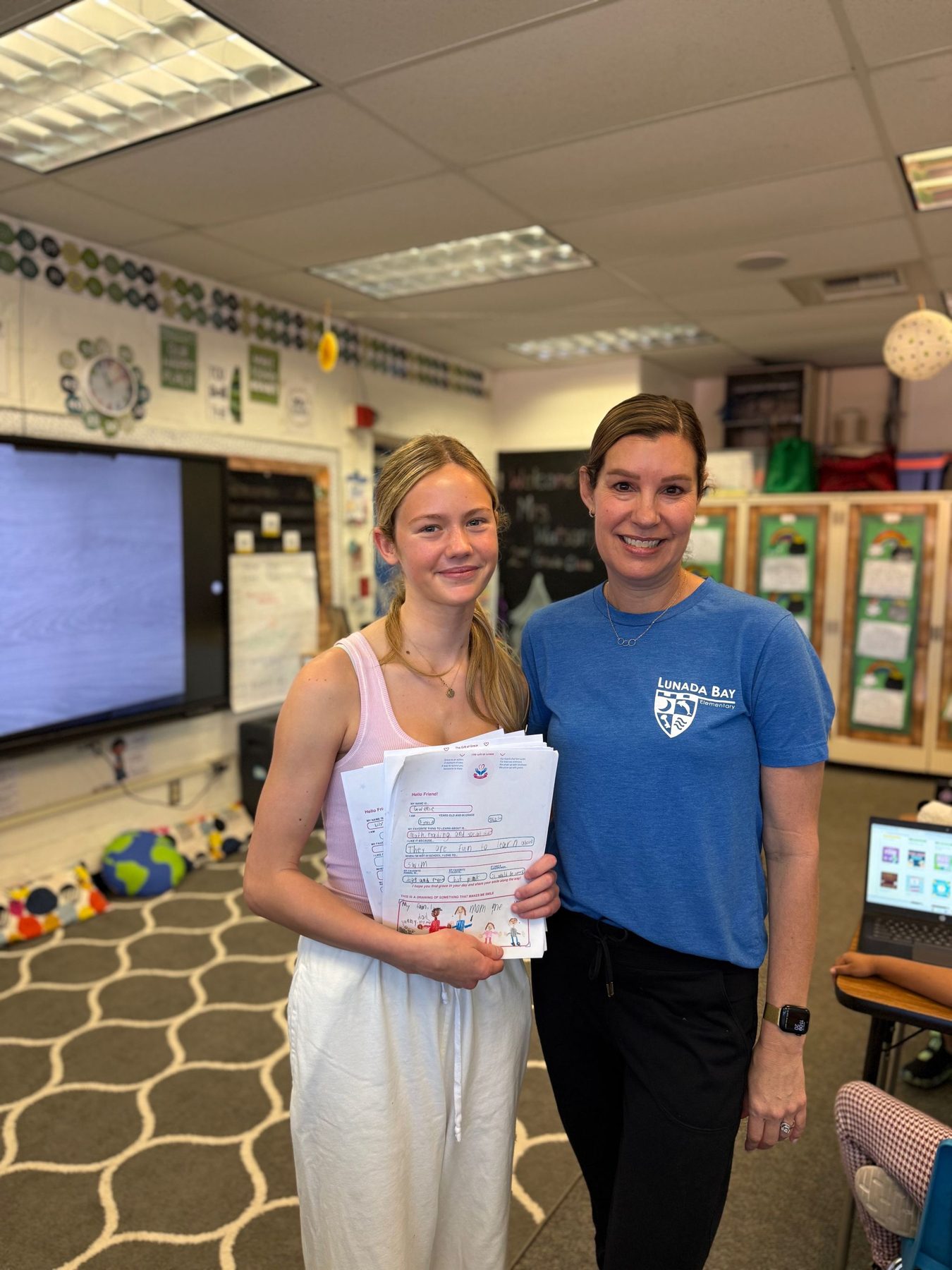 Grace with Ms. Watson in her classroom