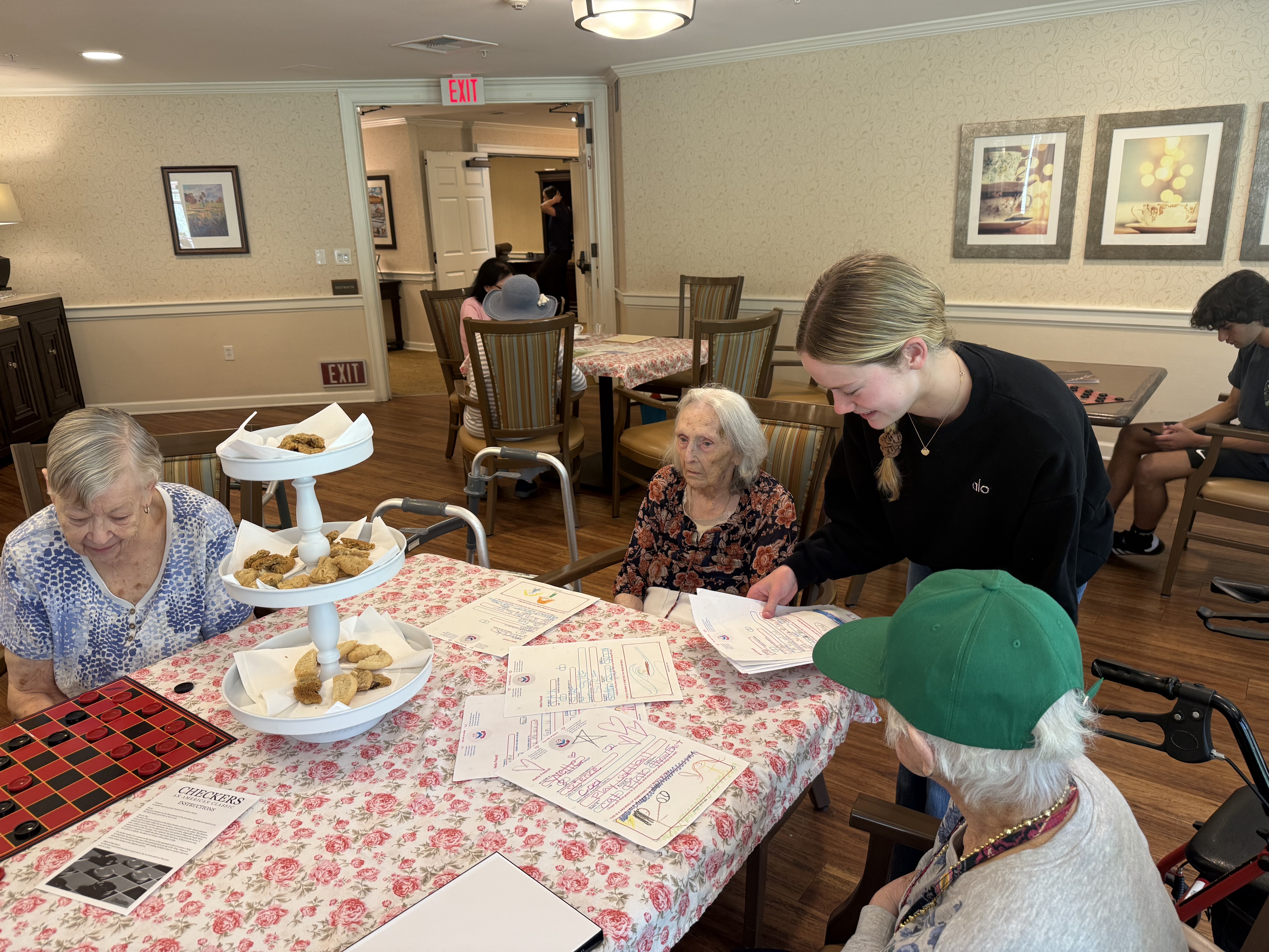 Group of residents and volunteers at Ivy Park during a Sending Grace visit
