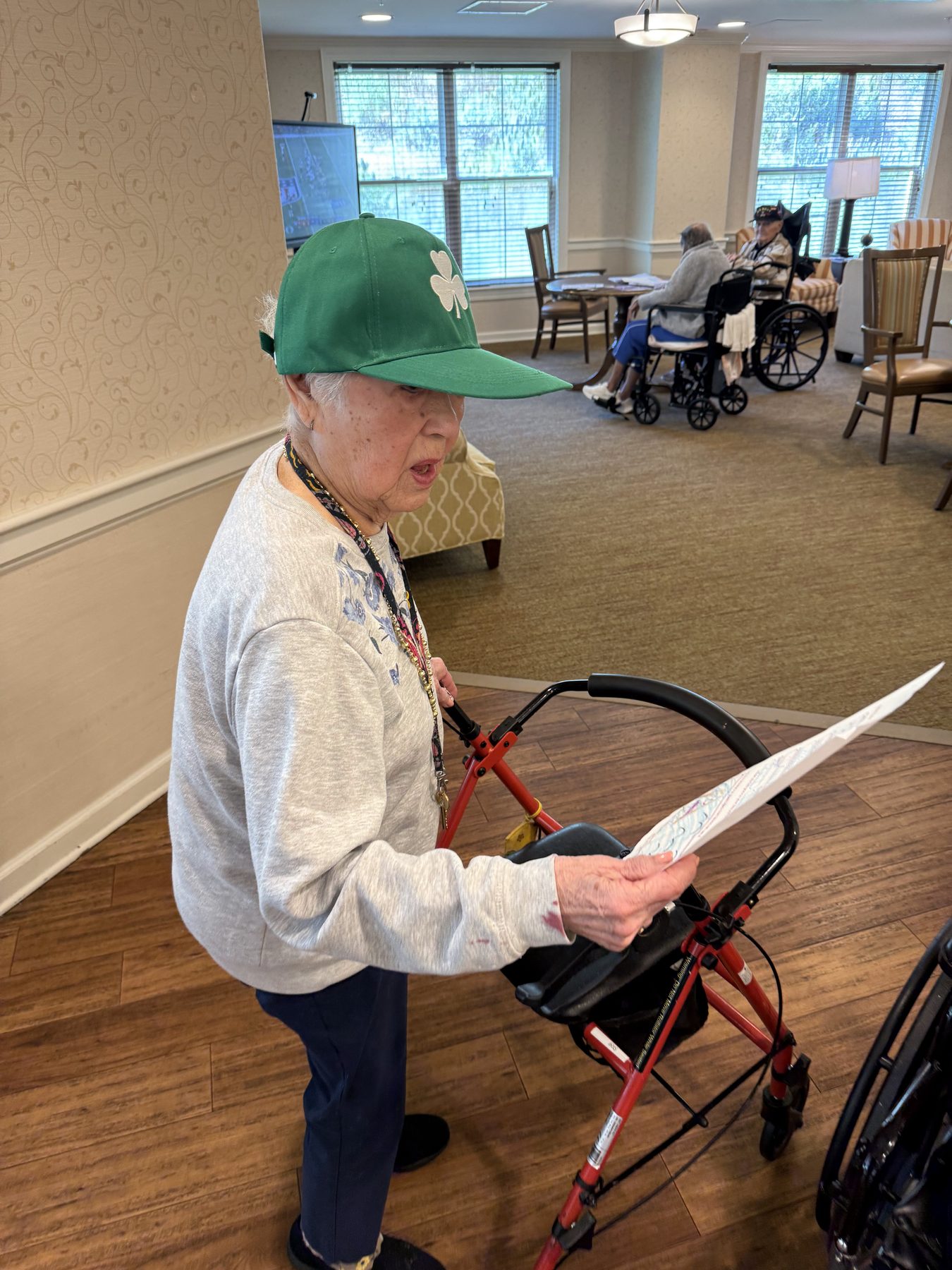 A resident reading her Sending Grace letter