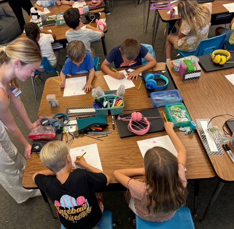 Grace helping students fill out their Sending Grace letters