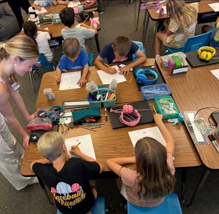 Grace helping students fill out their letters