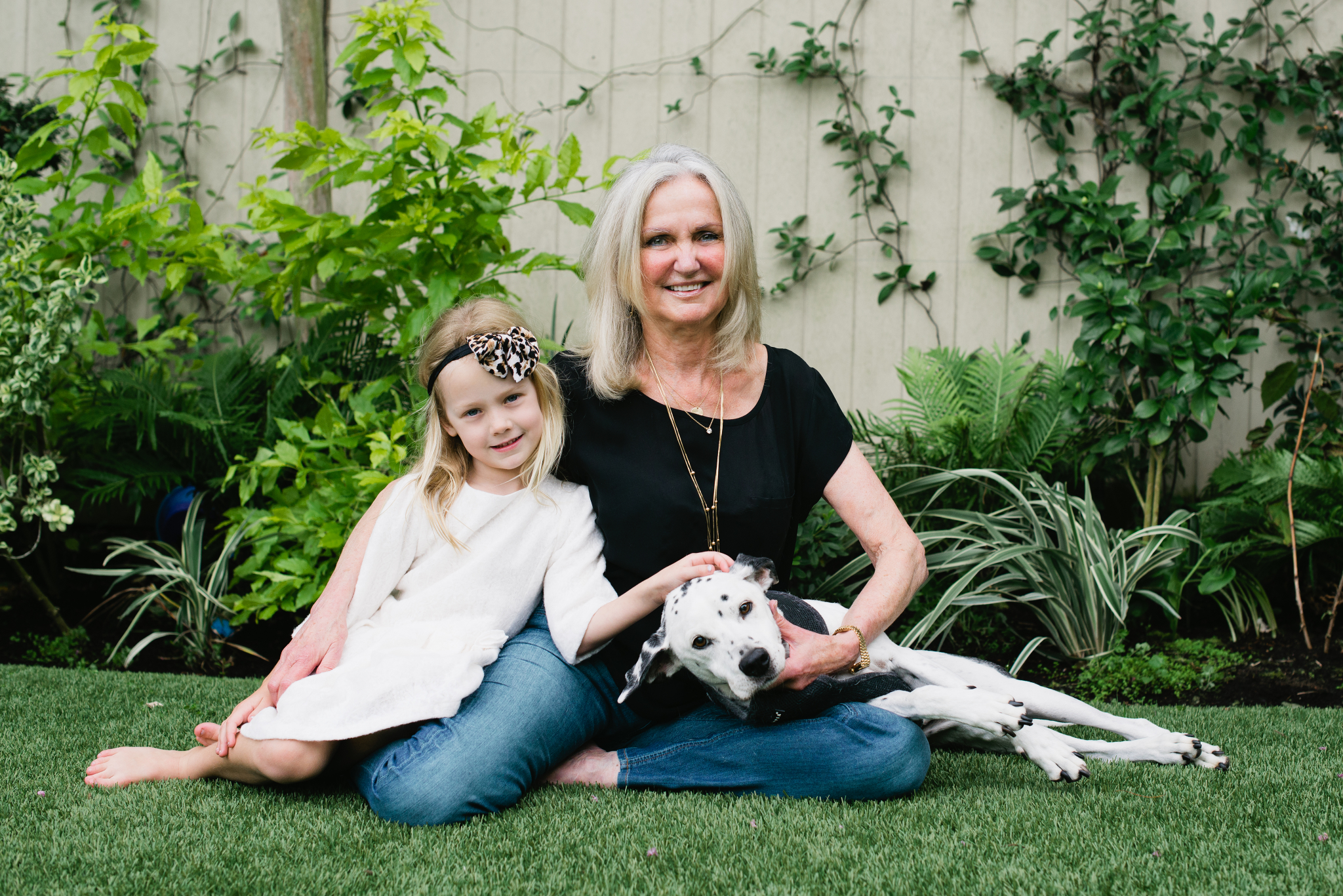 Young Grace with her grandma JoAnn and Duke the Dalmatian