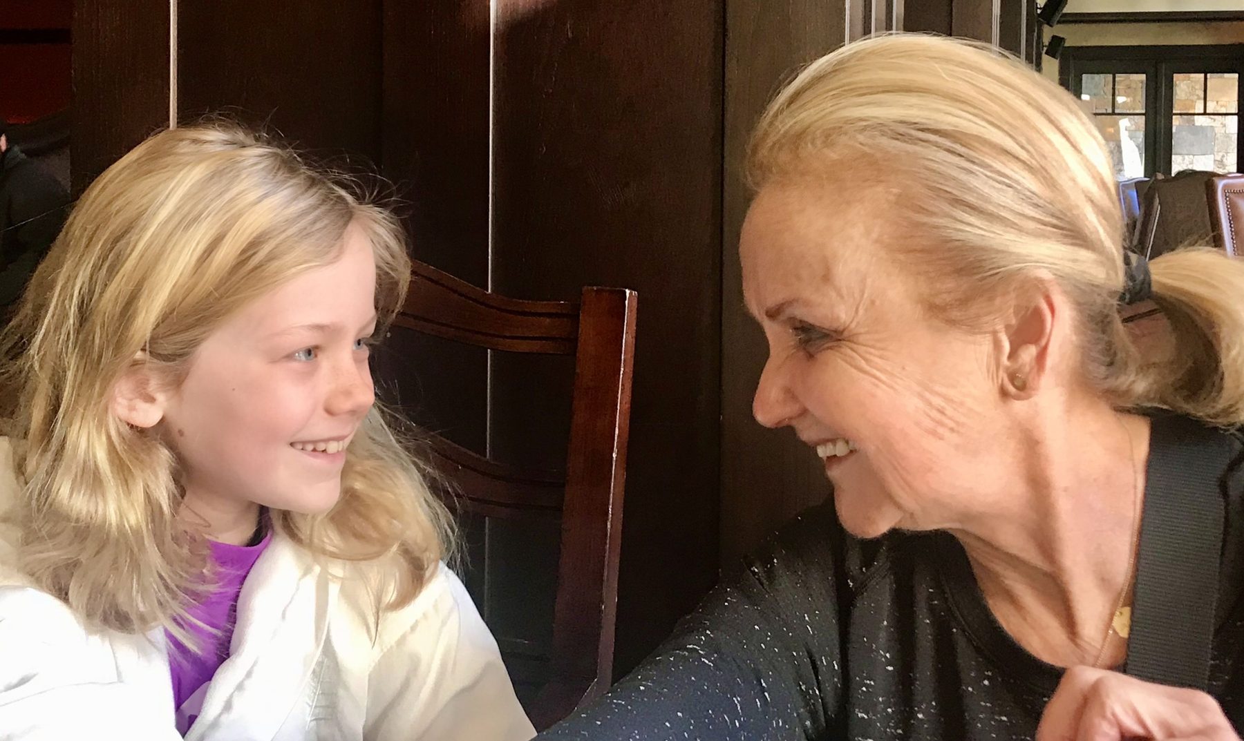 Grace as a young girl laughing with her grandma, DukeMom