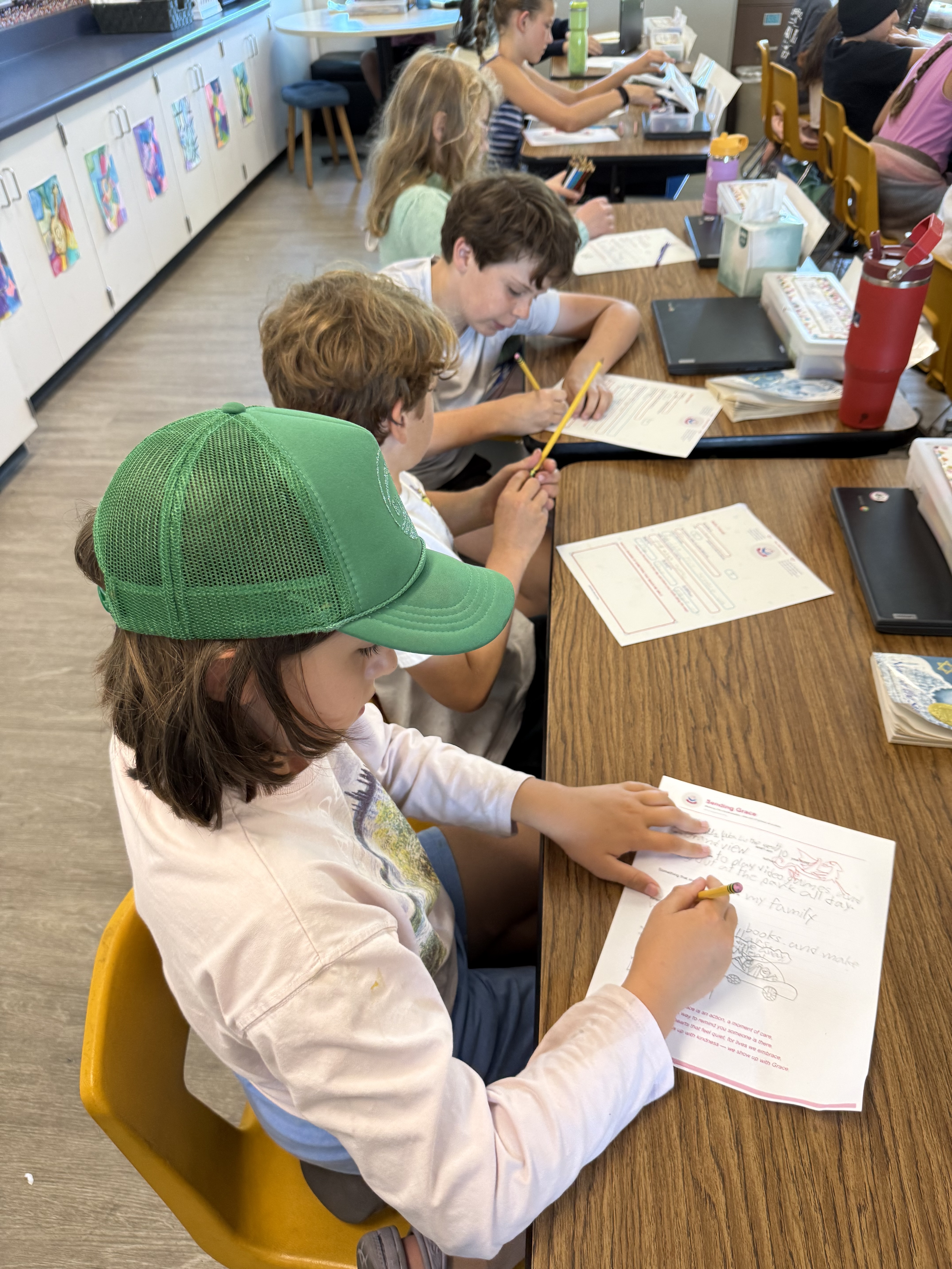 Two students writing their Sending Grace letters together