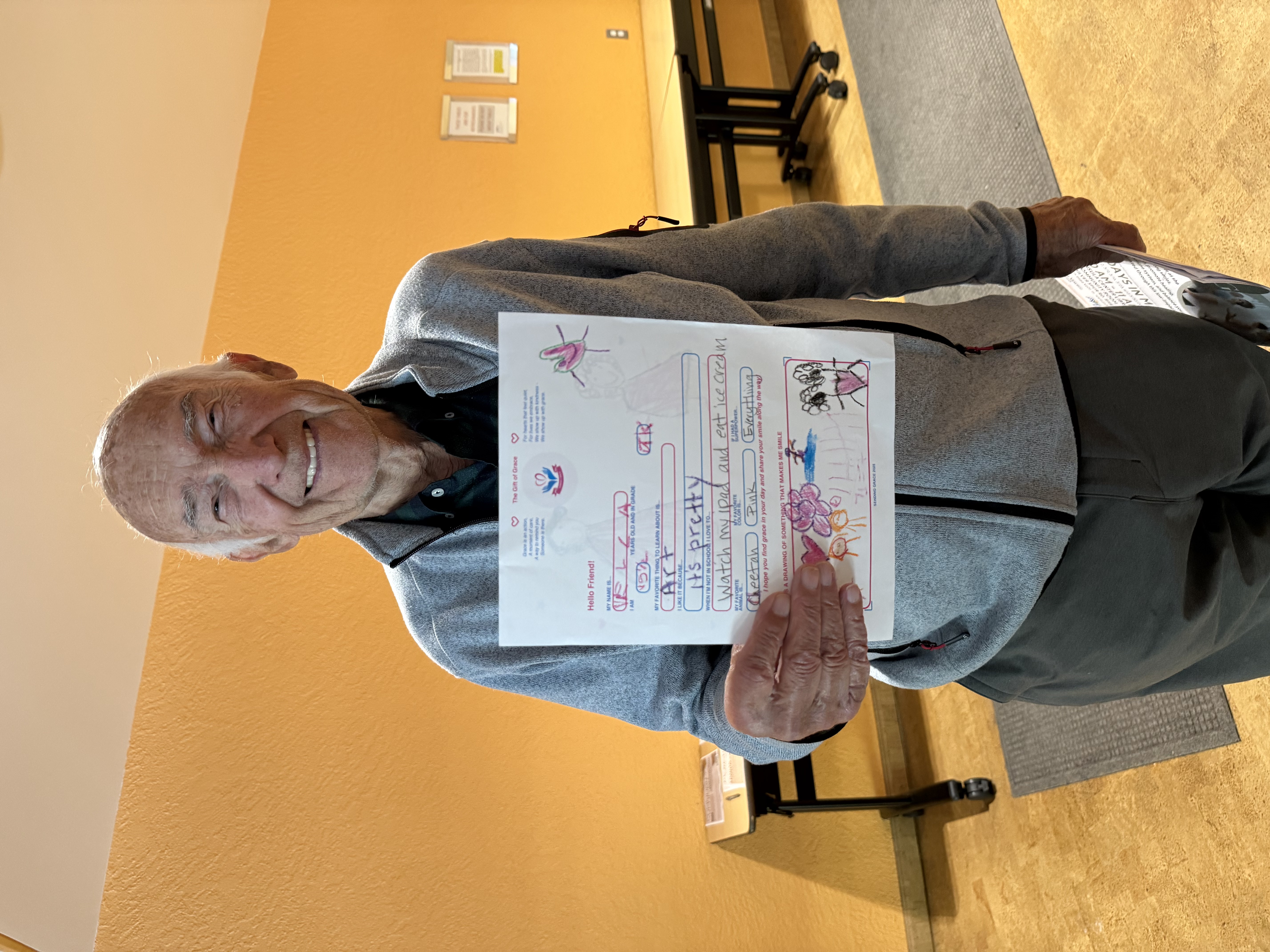 Dennis holding his Sending Grace letter