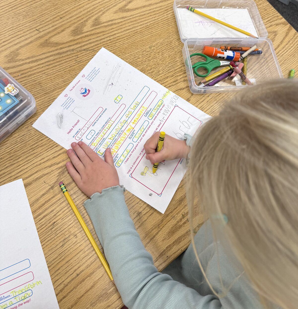 A student filling out a Sending Grace letter template