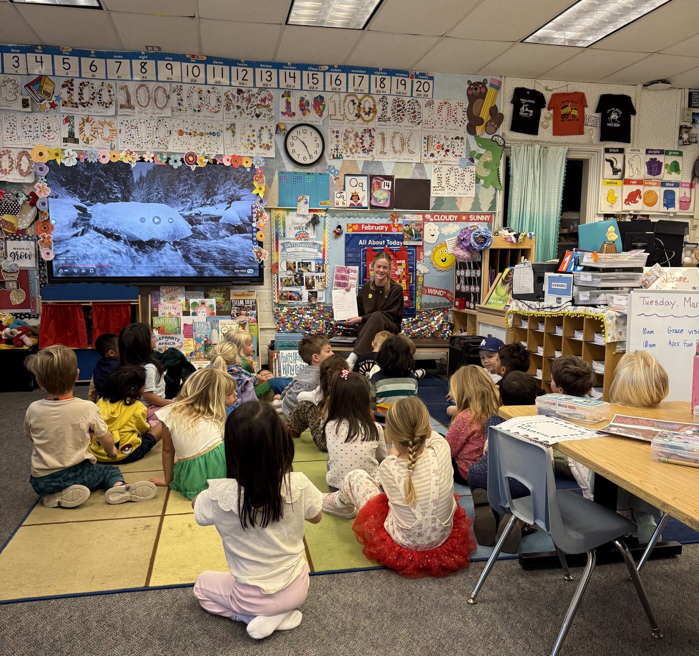 Grace presenting to a classroom of kids